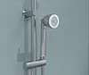 A close-up of a chrome shower head and rail against a textured blue wall. Produktbild-Vorschau