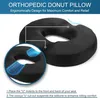 A black orthopedic donut pillow is shown with close-up views and text explaining its features. Produktbild-Vorschau