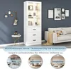 A white display cabinet with glass doors and drawers is shown in a living room setting, next to a sofa. The cabinet has LED lighting. Below the cabinet, there are three circular images showing the cabinet in different room settings: an office, a living roo Podgląd zdjęcia produktu