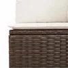 A close-up view of the top section of a brown rattan sofa with white cushions. Produktbild-Vorschau