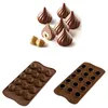 A collection of chocolate candies and two silicone molds for making them. Produktbild-Vorschau