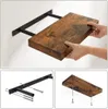 A collage showing a wooden shelf being installed on a wall, with close-ups of the mounting hardware and the shelf itself. Produktbild-Vorschau