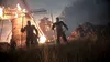 A group of armored figures stand in a grassy field in front of a burning windmill. Produktbild-Vorschau