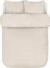 A top-down view of a neatly made bed with beige bedding. Produktbild-Vorschau