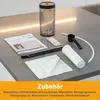 A collection of coffee machine accessories laid out on a countertop. Produktbild-Vorschau