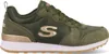 A side view of a green Skechers sneaker with gold accents. Voir les images du produit