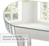 A mirrored console table reflecting a room with windows and greenery. Podgląd zdjęcia produktu