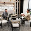 Two men playing chess in a modern, well-lit room. Anteprima dell’immagine prodotto