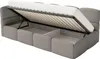 A grey upholstered bed frame with the mattress lifted to reveal storage compartments underneath. Produktbild-Vorschau