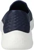 The back view of a navy blue Skechers slip-on shoe with a white sole. Produktbild-Vorschau