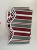 A folded awning valance with stripes is laid flat on a white surface. Produktbild-Vorschau