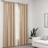 A room interior with beige curtains covering a window, a potted plant, and a white sofa. Produktbild-Vorschau