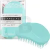 A teal Tangle Teezer hairbrush is shown in its packaging, with another brush placed next to it. Anteprima dell’immagine prodotto