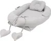 A baby nest with a pillow, shown from a diagonal angle. Produktbild-Vorschau