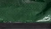 A close-up view of a green storage bag with a black trim at the bottom. Produktbild-Vorschau
