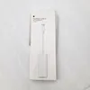 A white product box with an image of the adapter on it, placed on a textured white background. Produktbild-Vorschau