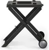 A black foldable grill stand with wheels, shown against a white background. Náhľad obrázku produktu