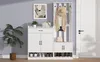 A white entryway furniture set including a shoe cabinet and a coat rack, placed in a room with a light gray wall and a white door. Produktbild-Vorschau