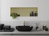A modern bathroom vanity with a black sink and gold faucet. Voir les images du produit