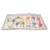 Several sheets of pressed flowers are laid out on a white background. Náhled obrázku produktu