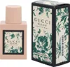 A perfume bottle and its packaging are displayed side-by-side against a white background. Náhled obrázku produktu