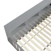 A close-up view of a grey bed frame with wooden slats. Produktbild-Vorschau
