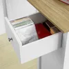 An open drawer filled with CDs and red containers, revealing part of a wooden countertop. Produktbild-Vorschau