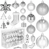 A collection of silver Christmas ornaments and decorations arranged on a white background. Produktbild-Vorschau