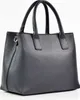 A black leather handbag is shown against a white background. Produktbild-Vorschau