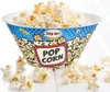 A bowl of popcorn with a decorative design on a white surface. Produktbild-Vorschau
