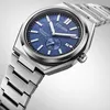 A close-up studio shot of a Citizen automatic titanium watch with a blue textured dial. Náhled obrázku produktu