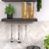 Kitchen counter with shelves holding pantry items and utensils. Náhled obrázku produktu