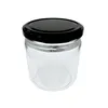 A clear studio shot of an empty glass jar with a black lid. Produktbild-Vorschau