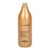 A gold-colored bottle of L'Oréal Professionnel hair conditioner. Produktbild-Vorschau