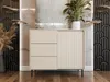 A modern beige dresser with a fluted door is placed in a stylish room with decorative wall panels and a plant. Náhľad obrázku produktu