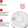 A close-up view of a white smoke detector with text callouts highlighting its features. Produktbild-Vorschau