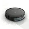 A black robot vacuum cleaner is shown on a white background, with dust particles scattered around it. Podgląd zdjęcia produktu