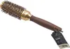 A round hair brush with a tag attached. Náhled obrázku produktu