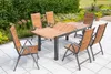 An outdoor patio with a wooden and metal dining set. Náhled obrázku produktu