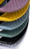 A stack of colorful, perforated trays or inserts, possibly for storage or organization. Produktbild-Vorschau