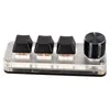 A macro keyboard with three black keys and one silver knob, presented on a clear acrylic base. Náhled obrázku produktu
