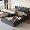 A modern bedroom with a grey upholstered bed frame, featuring a lifted mattress revealing storage space underneath. The bed has LED lighting along the headboard and base. Produktbild-Vorschau