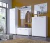 A modern entryway set with a tall cabinet, shoe bench with cushion, and a shoe cabinet, all in white high gloss finish, set against a yellow wall. Produktbild-Vorschau