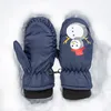 A pair of children's mittens lying in the snow. Náhled obrázku produktu