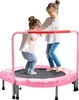 Two young girls are playing on a small trampoline. Produktbild-Vorschau
