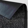 Close-up view of the texture and backing of a doormat. Voir les images du produit