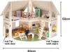 A wooden dollhouse with furniture and dolls, shown with dimensions. Produktbild-Vorschau