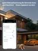 A smartphone displaying a security camera app interface is held in front of a modern house with a car and a dog in the driveway. Anteprima dell’immagine prodotto