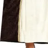 A close-up view of the lower part of a dress with a brown velvet cape and a beige dress with gold trim. Produktbild-Vorschau