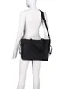 A black handbag is displayed on a white mannequin. Produktbild-Vorschau